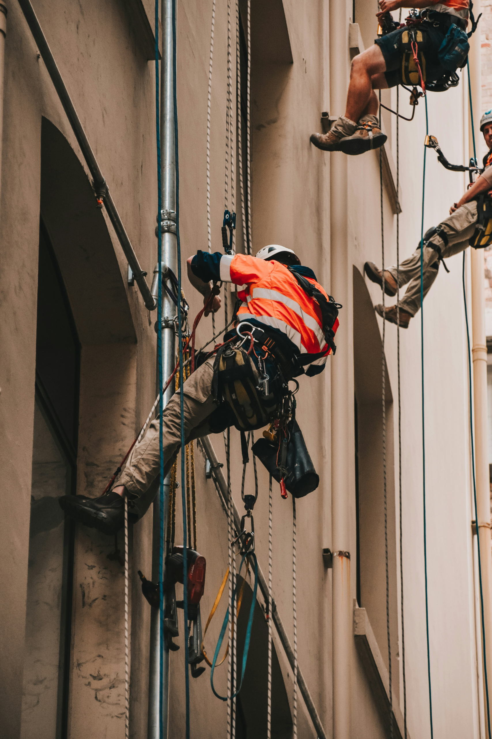 EHS Worker Safety Multiple Workers On Wall